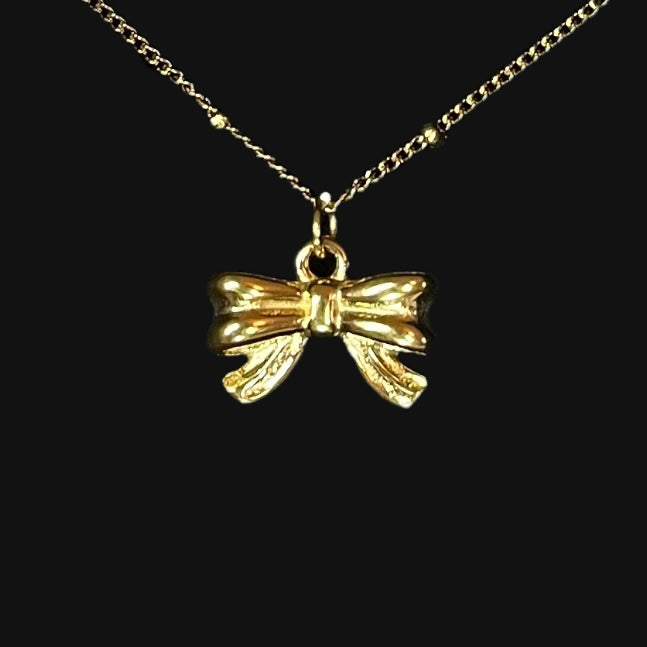 Bow necklace guld